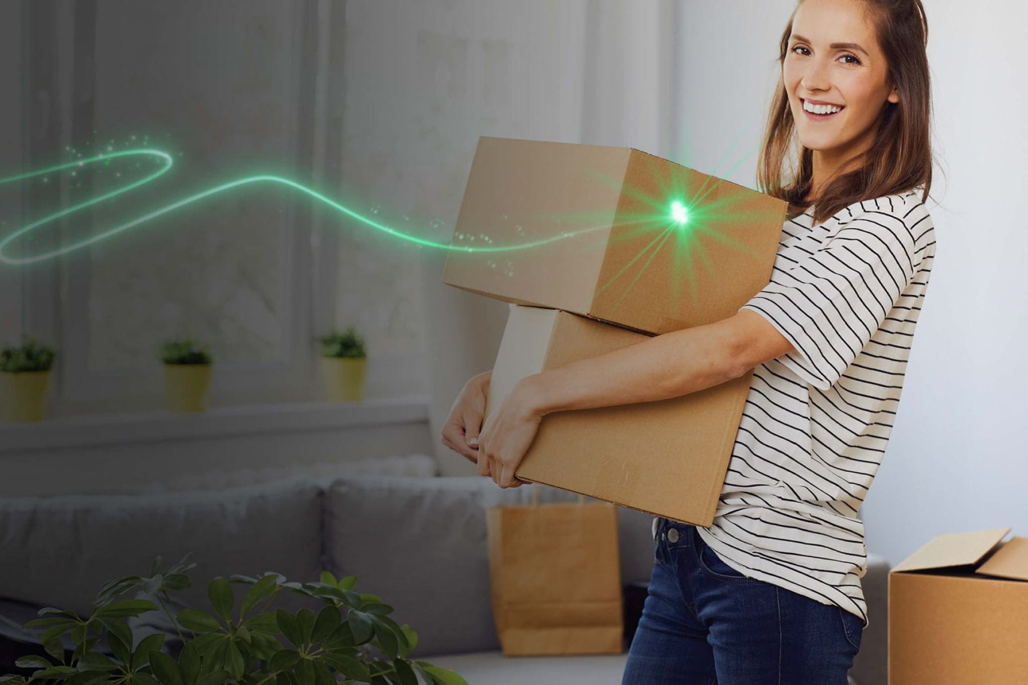 Smiling lady moving boxes