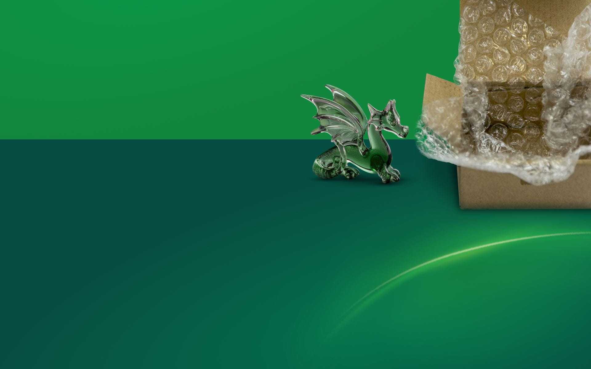 Glass dragon and box with bubble wrap