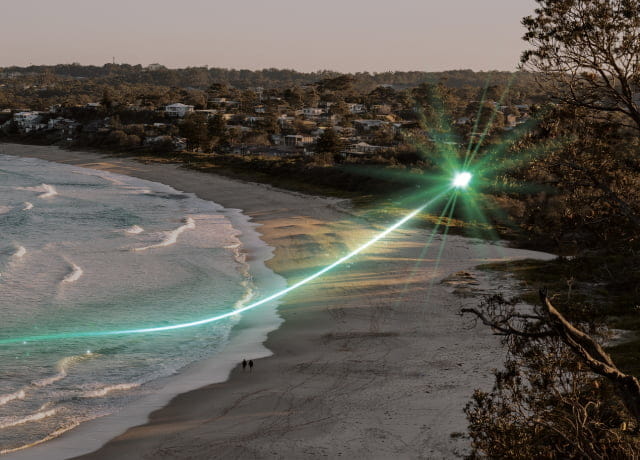 A South Coast beach with waves gently lapping the sand