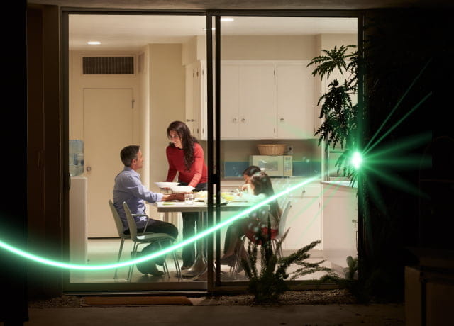 A happy family enjoying dinner in their living room