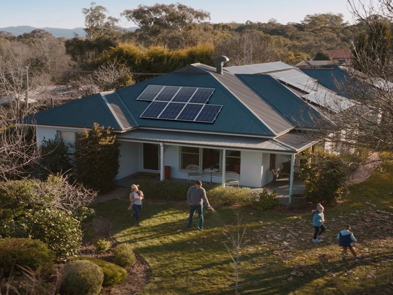 A home featuring solar panels on the roof