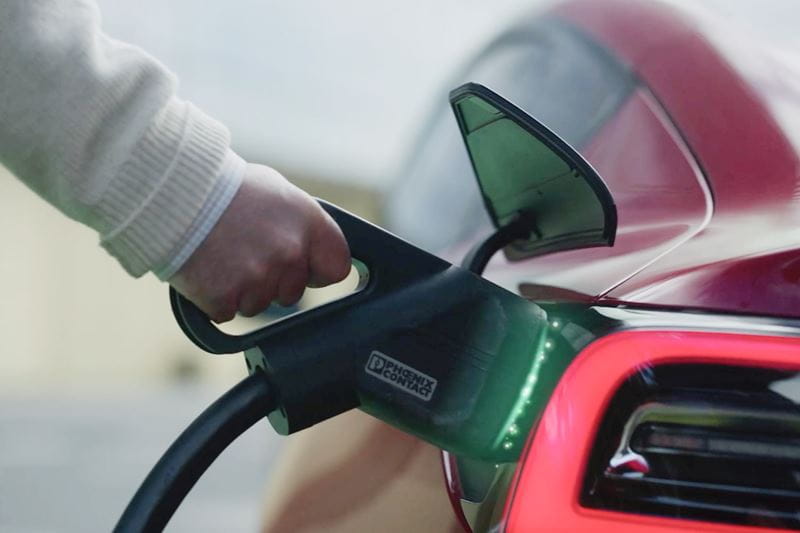Tesla electric car being charged with an EV charger