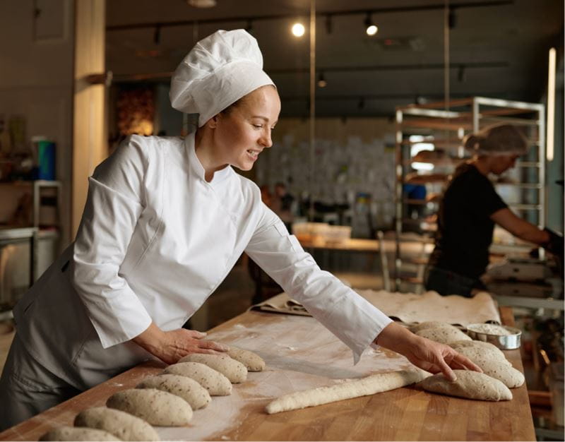 Baker working in bakery