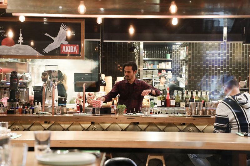 Bartender working behind the bar at a local establishment