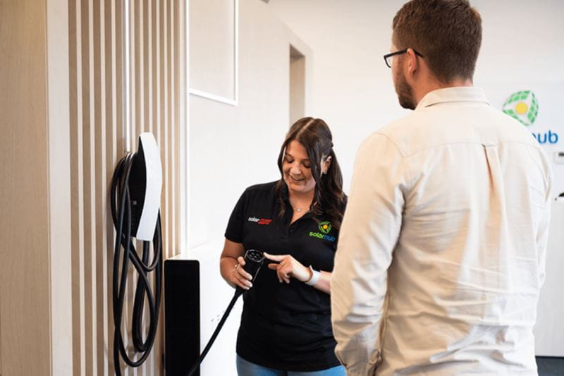 A woman explaining energy-efficient solutions 