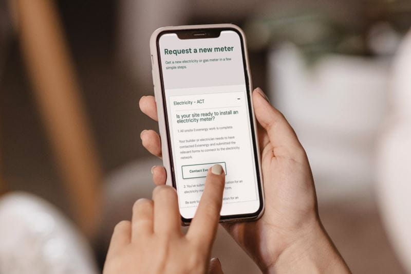 A person holding a mobile phone with a message on it