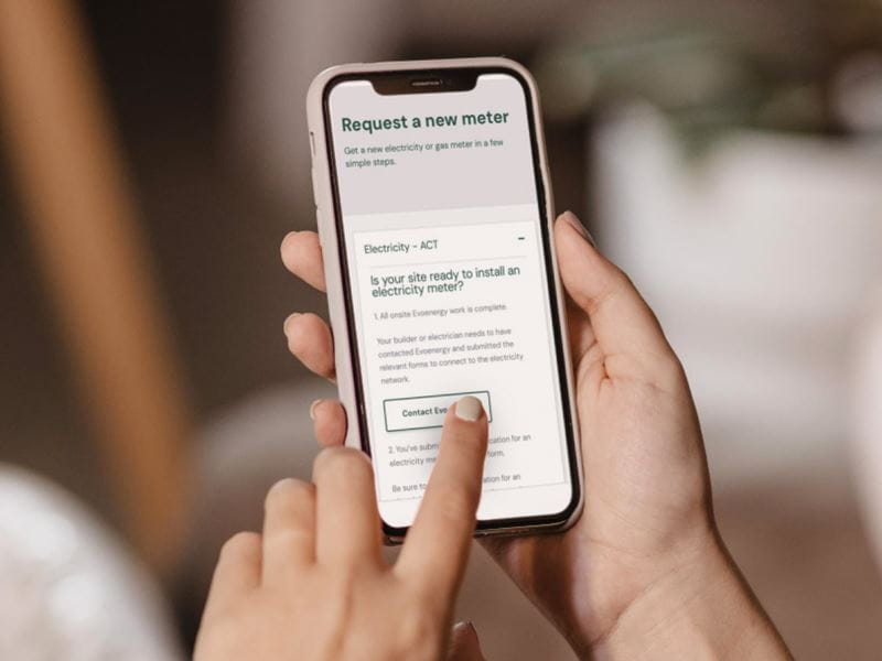 Someone is holding a phone with a message on the screen