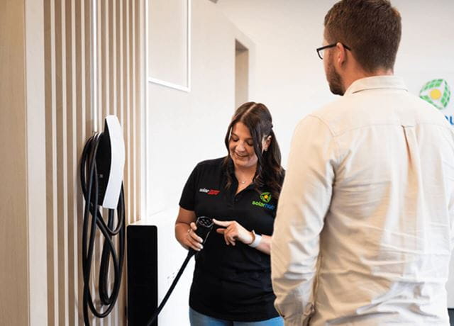 People learning how EV chargers work