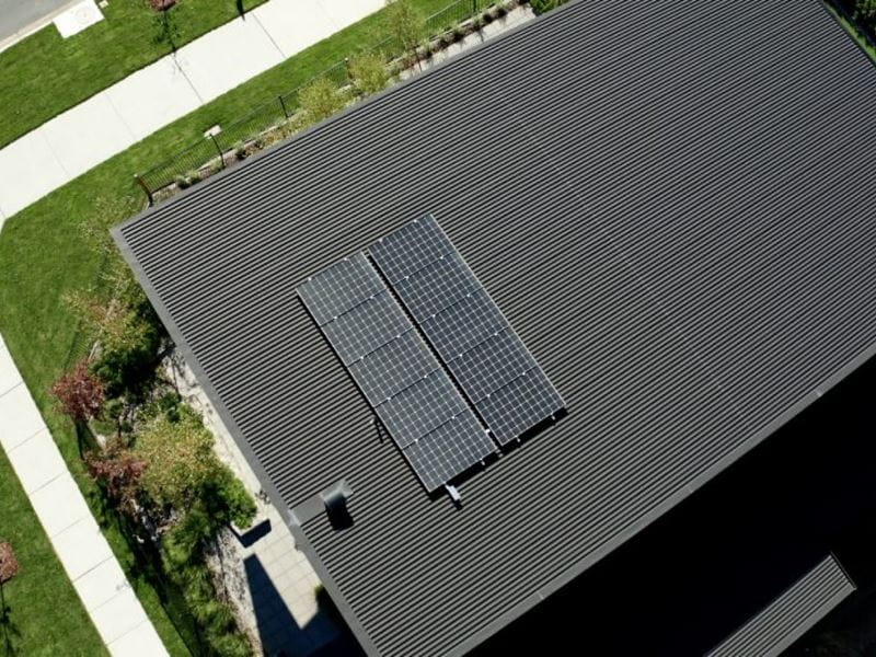 An energy efficient home with a solar panel on the roof