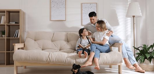 Family on couch heating and cooling upgrade