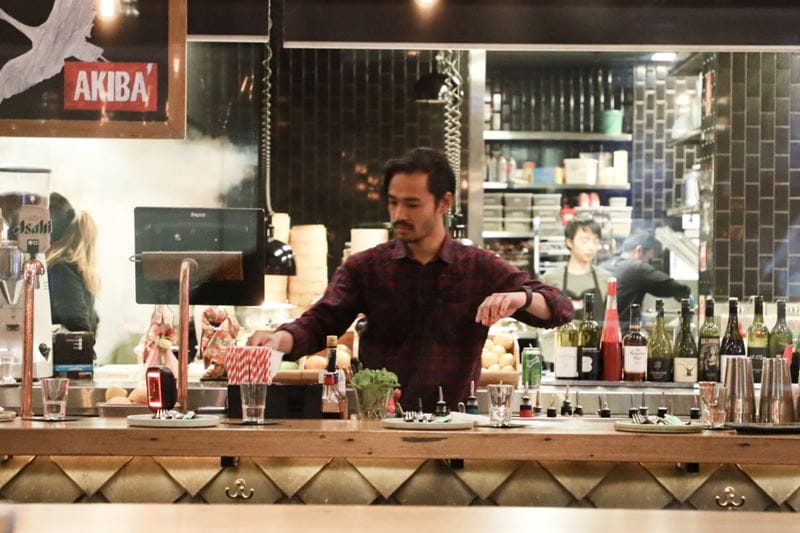 A man standing behind a counter