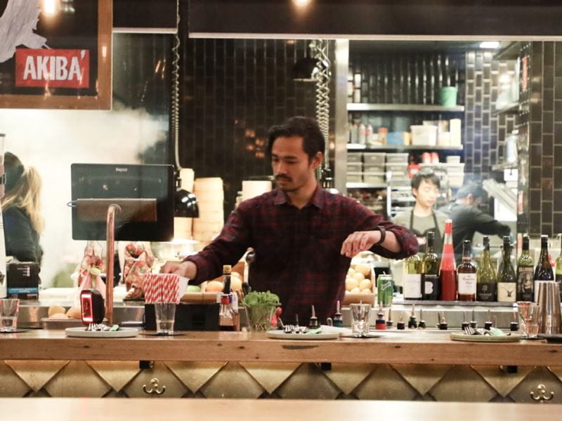 A bar tender serving drinks