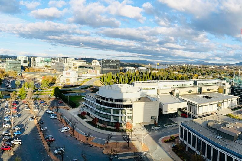 A city with a road and commercial buildings